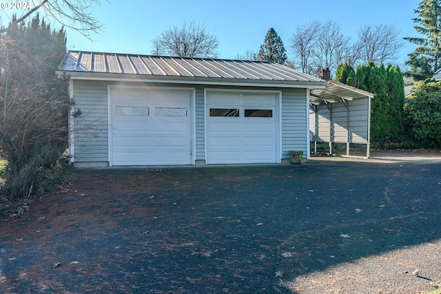 garage featuring a carport