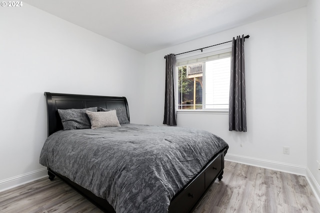 bedroom featuring hardwood / wood-style floors