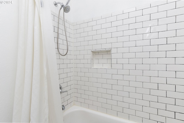 bathroom featuring shower / bath combo with shower curtain