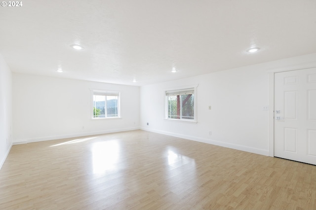 spare room featuring light wood-type flooring