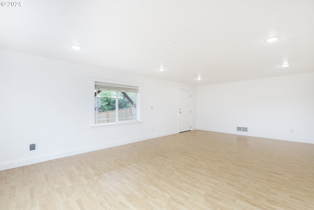 spare room with light hardwood / wood-style floors