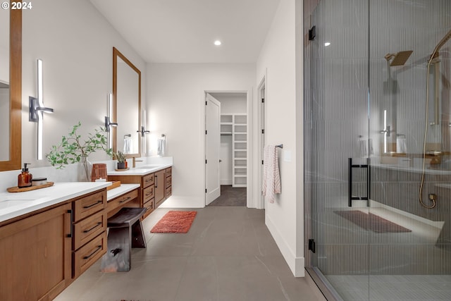 bathroom with tile patterned floors, vanity, and an enclosed shower