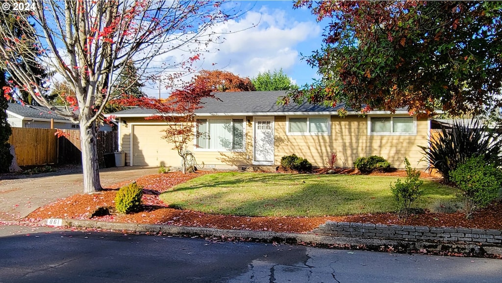 ranch-style house with a front lawn