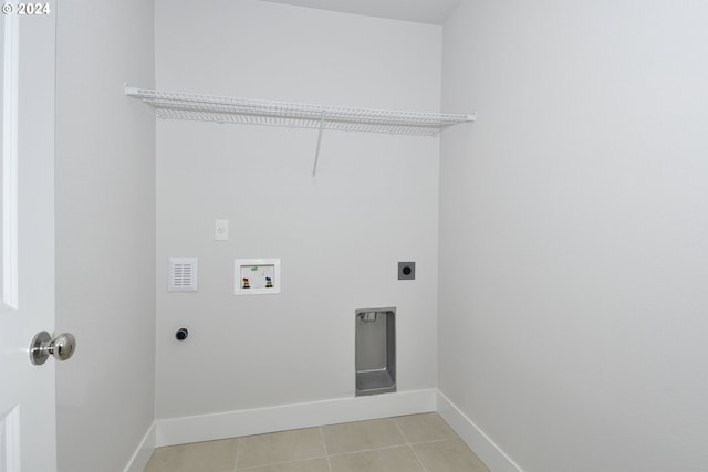 laundry room featuring hookup for a washing machine, electric dryer hookup, and light tile patterned floors