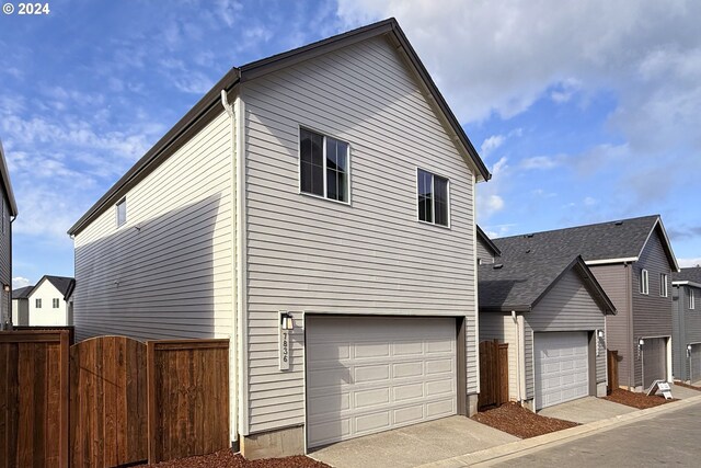 view of side of home with a garage