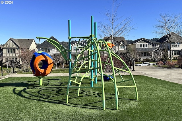 view of jungle gym with a lawn