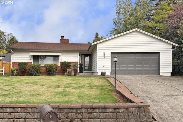 ranch-style home with a garage and a front lawn