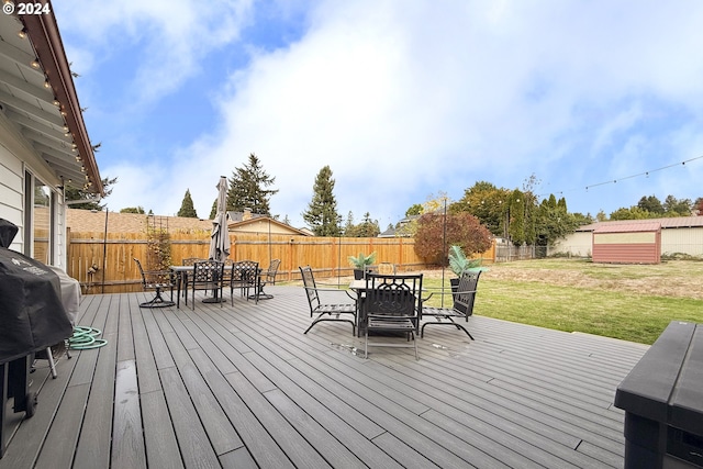 wooden deck featuring a yard