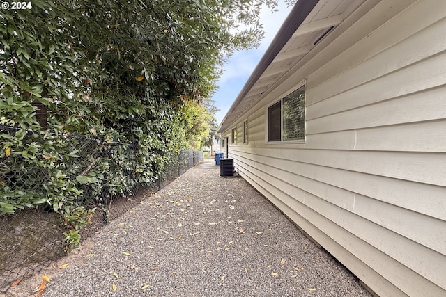 view of side of home featuring central air condition unit