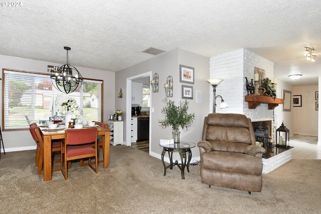 carpeted dining room featuring a chandelier, a brick fireplace, and a textured ceiling