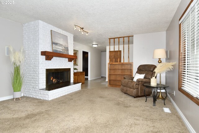 15318 SE Oatfield Rd, Milwaukie, OR 97267 - living room with carpet floors, a textured ceiling, baseboards, and a fireplace