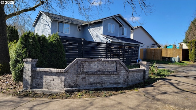 view of front facade featuring fence