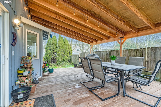 deck with fence and outdoor dining area