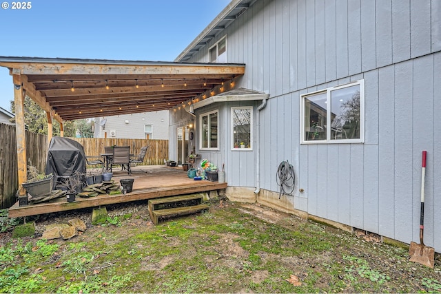 view of yard featuring fence and a deck