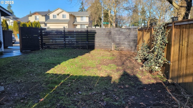 view of yard with a fenced backyard