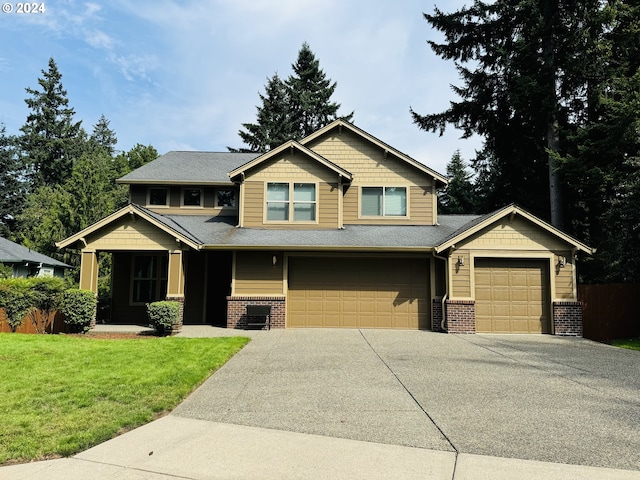 craftsman-style house with a garage and a front lawn