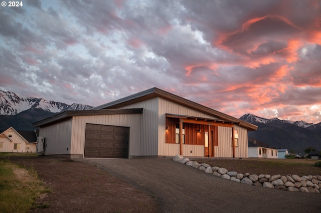 view of front of house with a mountain view and a garage