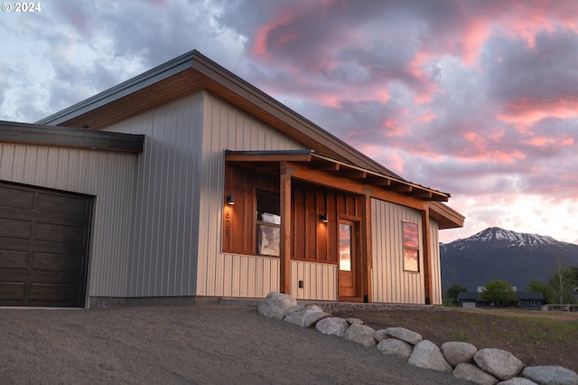 view of front of house featuring a mountain view and a garage