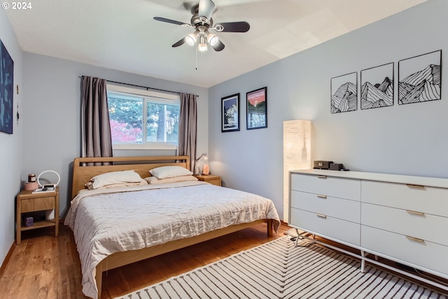 bedroom featuring light hardwood / wood-style floors and ceiling fan