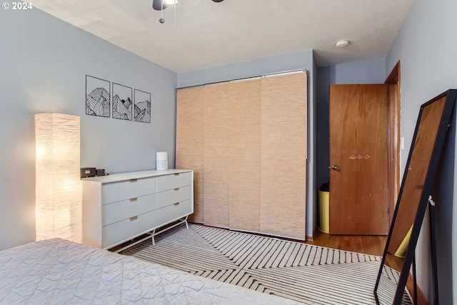 bedroom featuring a closet, ceiling fan, and light hardwood / wood-style floors