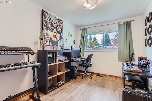 office space with light hardwood / wood-style flooring