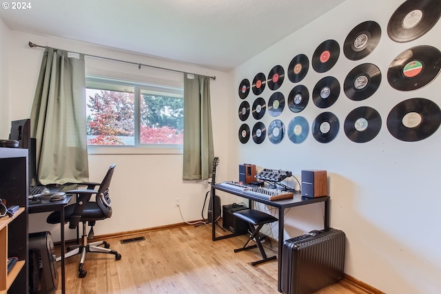 office area with light hardwood / wood-style flooring