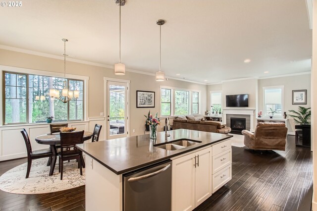 13632 SW 174th Loop, Sherwood, OR 97140 - kitchen featuring stainless steel dishwasher, a sink, dark countertops, dark wood-style flooring, and recessed lighting