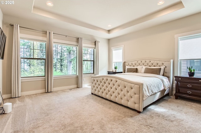 13632 SW 174th Loop, Sherwood, OR 97140 - bedroom with a tray ceiling, light colored carpet, multiple windows, and recessed lighting