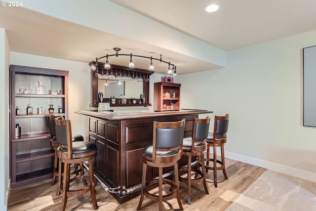 13632 SW 174th Loop, Sherwood, OR 97140 - indoor dry bar with light wood finished floors, baseboards, track lighting, and recessed lighting
