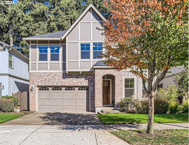 13632 SW 174th Loop, Sherwood, OR 97140 - tudor home featuring stucco siding, an attached garage, concrete driveway, and brick siding