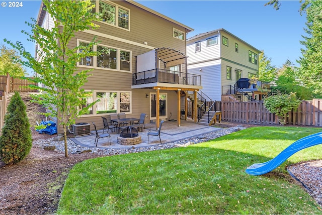 13632 SW 174th Loop, Sherwood, OR 97140 - back of property featuring stairway, a wooden deck, a patio, and central air condition unit