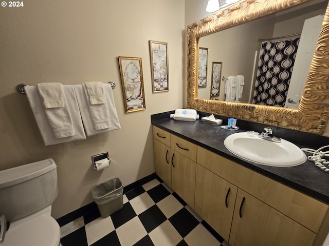 bathroom with vanity and toilet