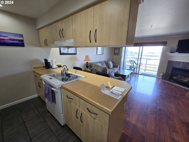 kitchen with a fireplace, white electric range oven, light brown cabinets, dark hardwood / wood-style flooring, and range hood