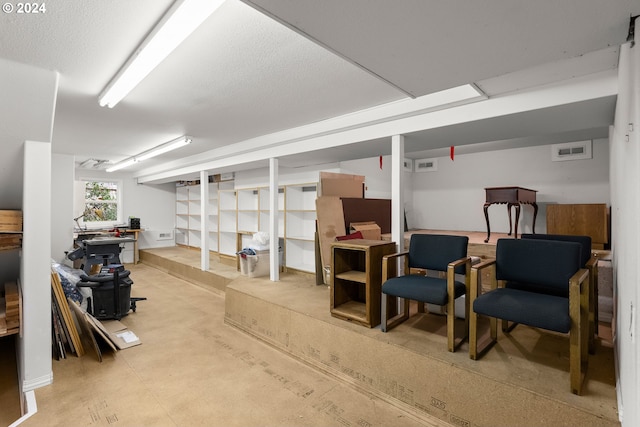 basement featuring a textured ceiling