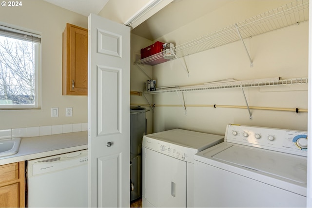 washroom featuring washer and dryer and sink