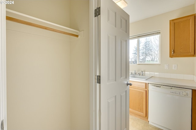 interior space with sink and light tile patterned floors