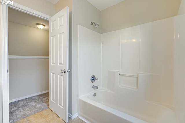 bathroom with shower / washtub combination and tile patterned flooring