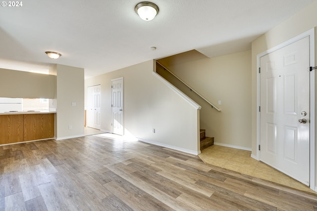 entryway with light hardwood / wood-style flooring