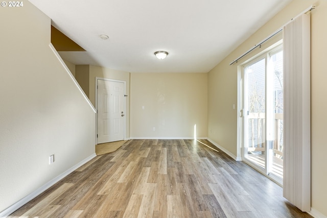 spare room featuring light hardwood / wood-style floors