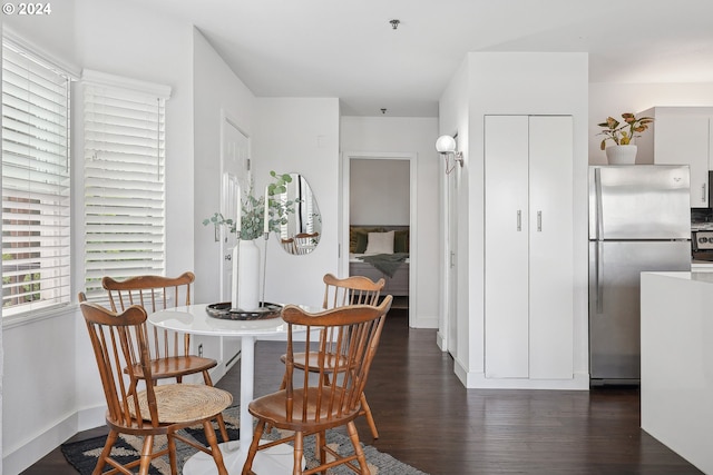 dining area featuring dark hardwood / wood-style flooring