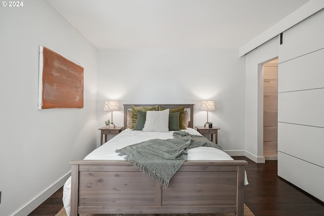 bedroom with dark hardwood / wood-style flooring