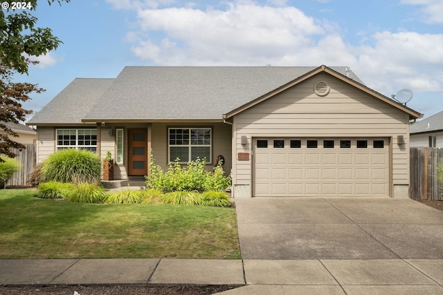 view of front of property featuring a garage and a front lawn