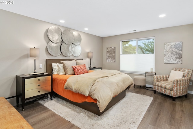 bedroom with dark wood-type flooring