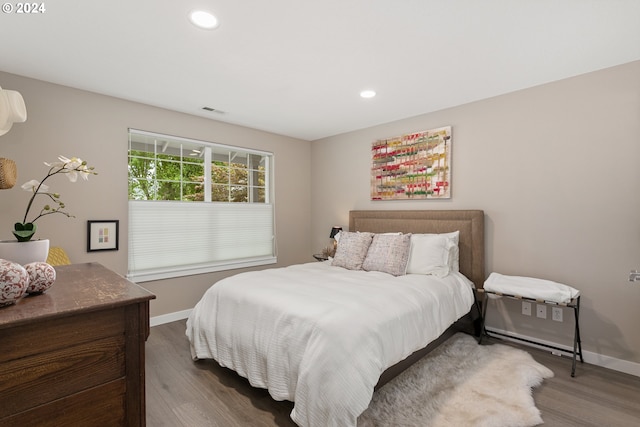 bedroom with wood-type flooring