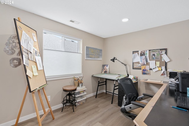 office area with light hardwood / wood-style flooring