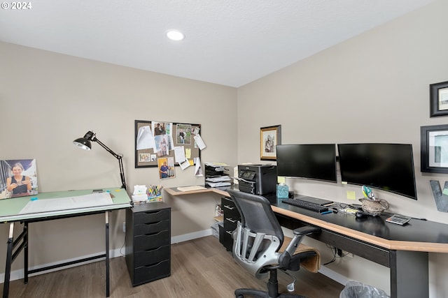 office space with light hardwood / wood-style floors