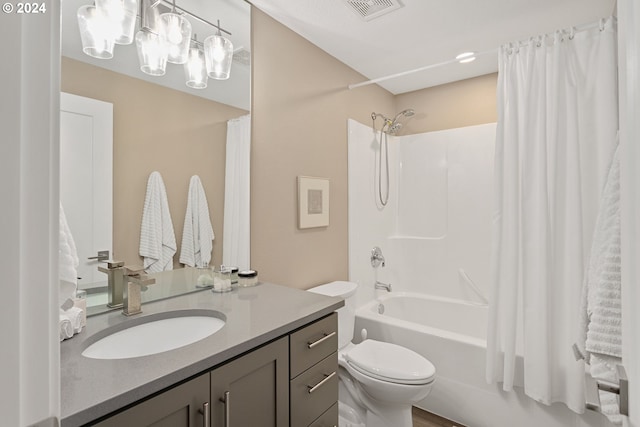 full bathroom featuring vanity, shower / tub combo, and toilet