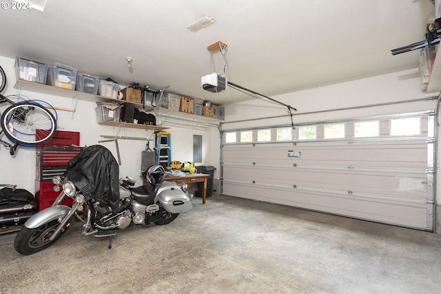 garage featuring a garage door opener