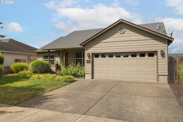 view of front facade with a garage and a front yard