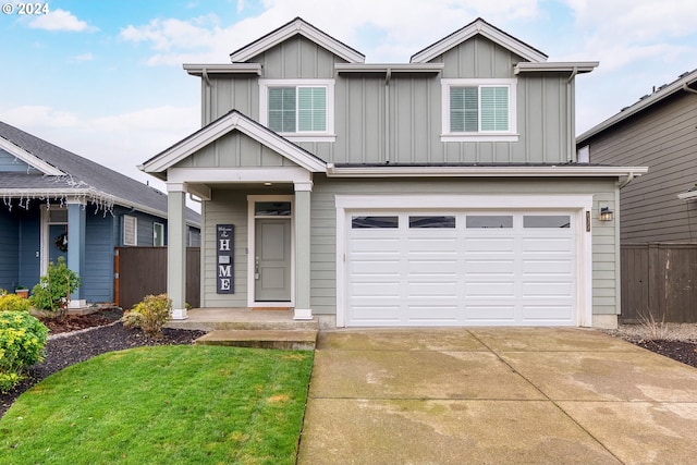 view of front facade featuring a garage and a front lawn